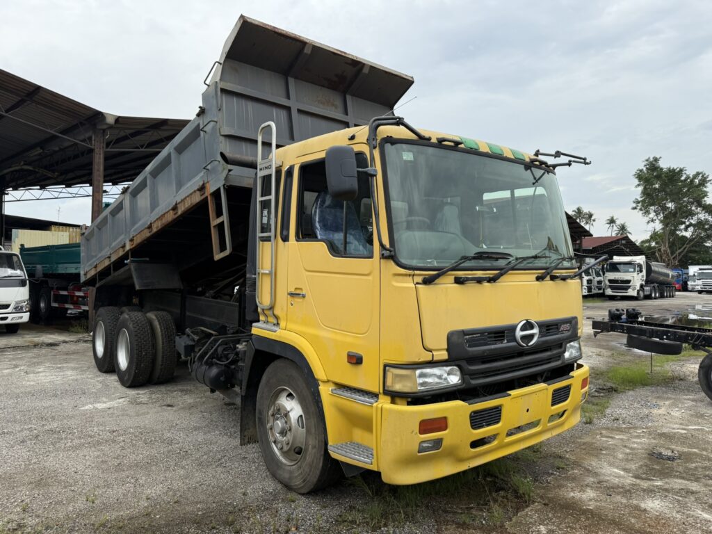 Side view of the Hino FR1K 19.5ft Steel Tipper, showcasing its robust steel body and built for heavy-duty transport.
