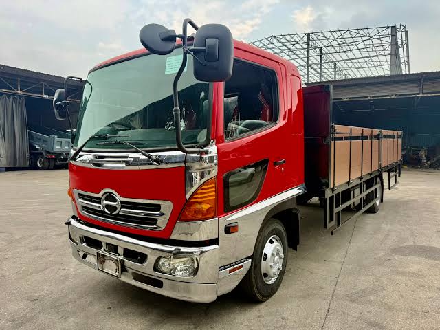 Baby Hino 500 FD8 wooden cargo truck for medium-duty transport.
